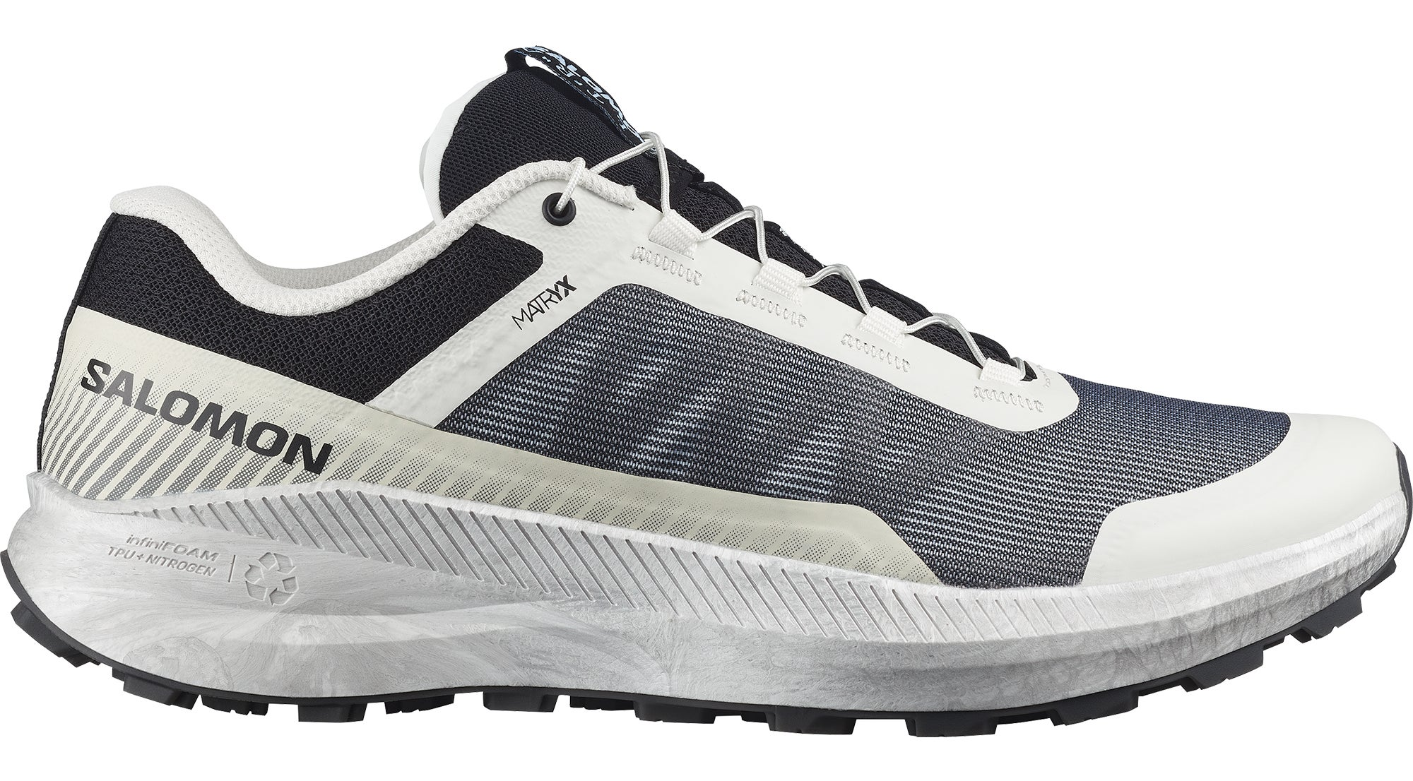 Chaussure de trail Salomon blanche et noire avec semelle crantée et design aérodynamique
